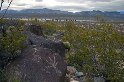 petroglyphs and mountains in the east.