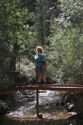 Diana Northup on a bridge over Columbine Creek
