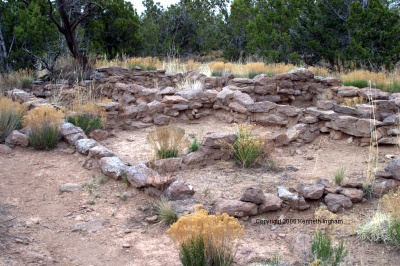Walls enclosing the remains of a few square rooms
